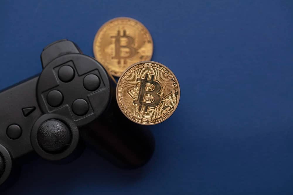 Crypto Gaming Concept Video Game Controller With a Bitcoin Cryptocurrency Coin