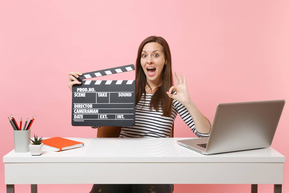 Amazed Woman Showing Ok Sign Holding Classic Black Film Making Clapperboard